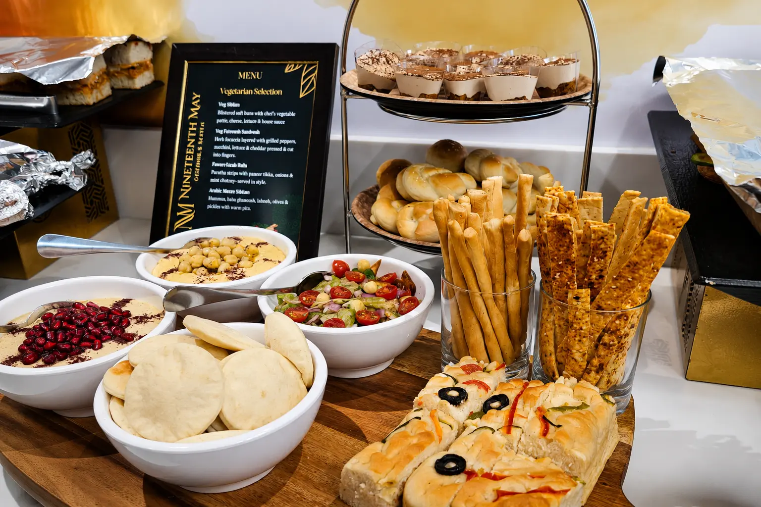 Original Nineteenth May catering buffet with breads, mezze and desserts